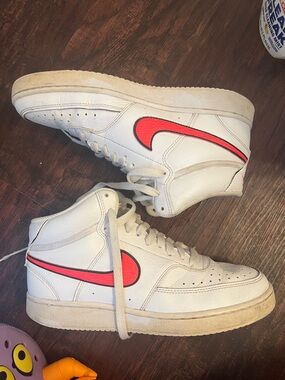 Nike White High-Top Sneakers with Red Swoosh